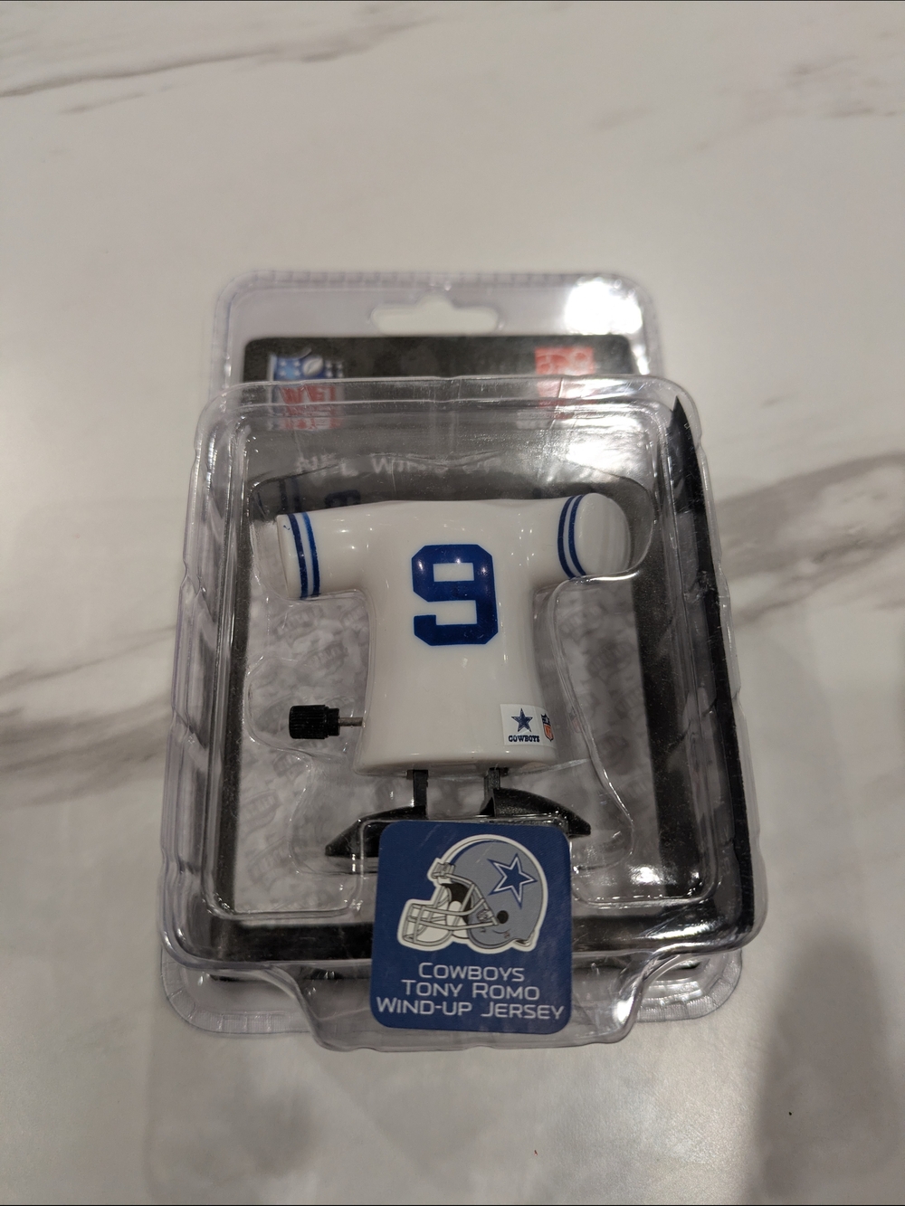 NFL Dallas Cowboys Wind-Up Jersey Phone Charm - White/Blue